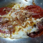 eggs and tomato with a little fried onions inside
