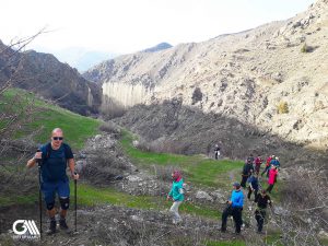 there is group hiking for two days and you can see a line of people walking in Alamut valley. 
