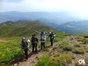 4 people which one of them is a female are walking in the mountains of alamut north of Ovan Lake