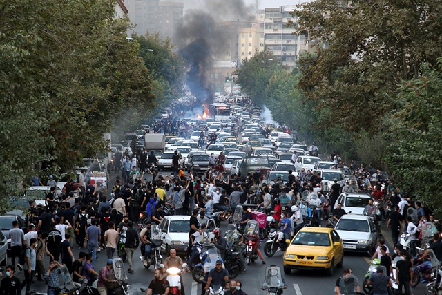 protests and crowds of people and police in iran